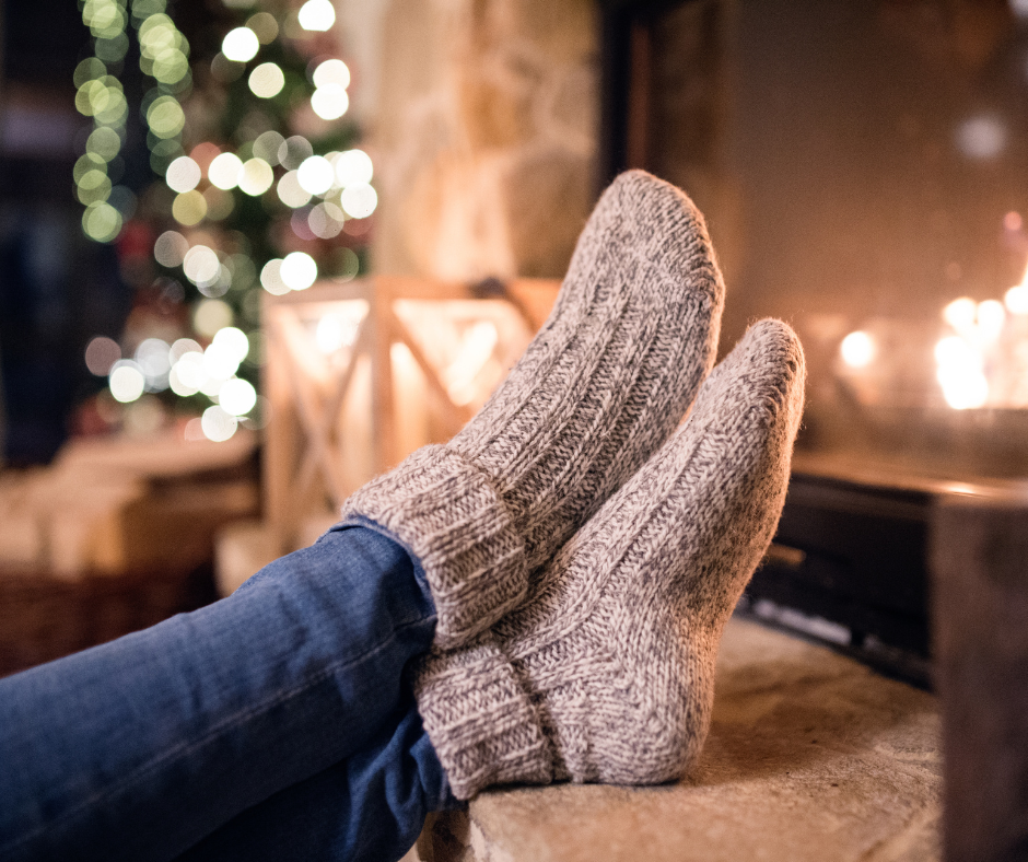 Feet by a fire place