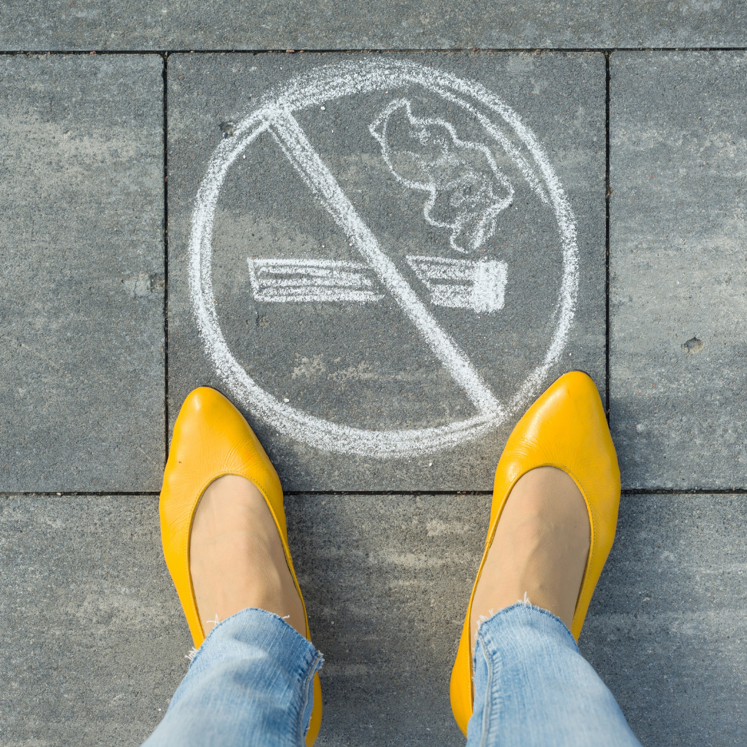 Feet and no smoking sign